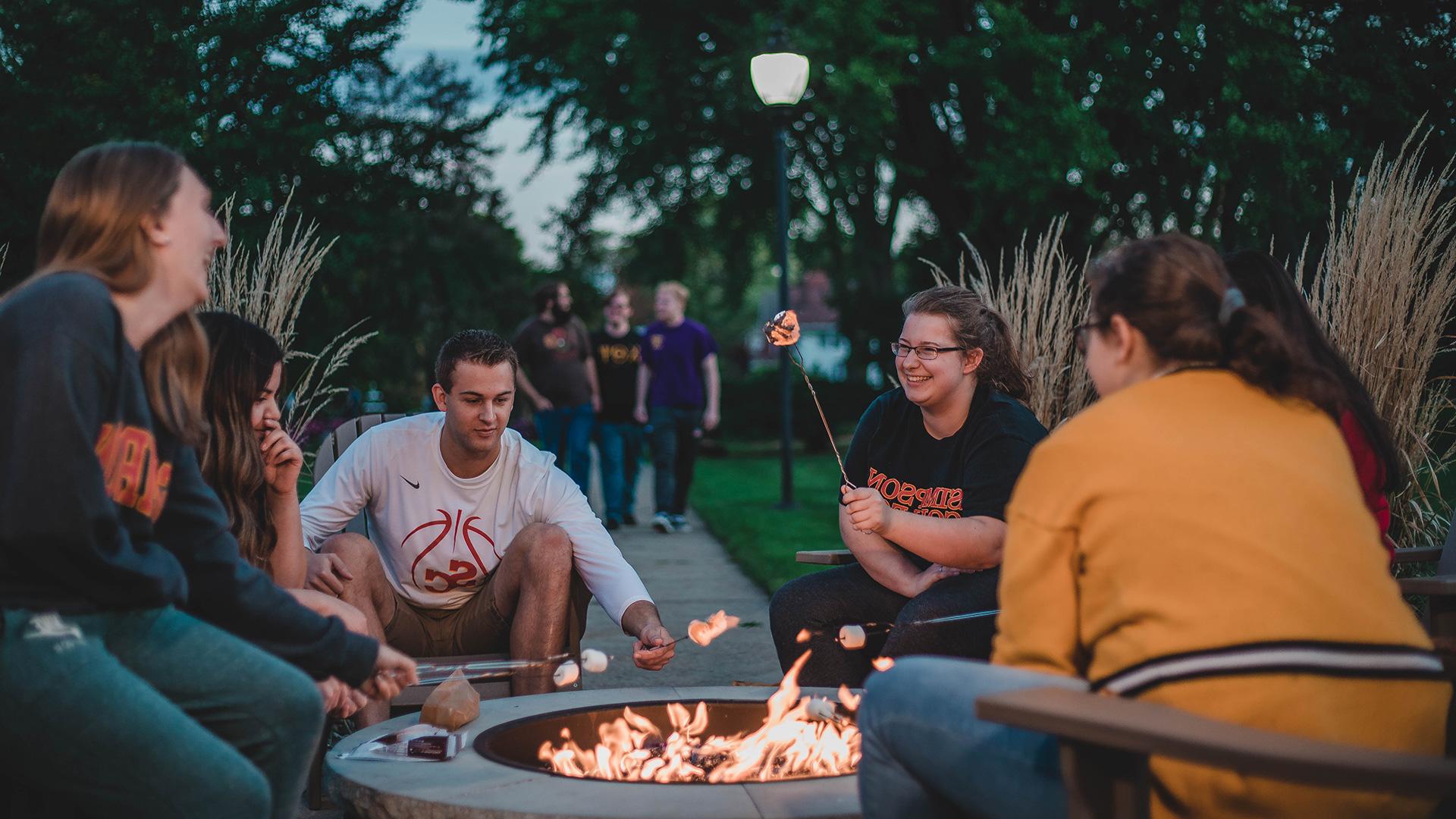 Simpson College students around the campus firepit