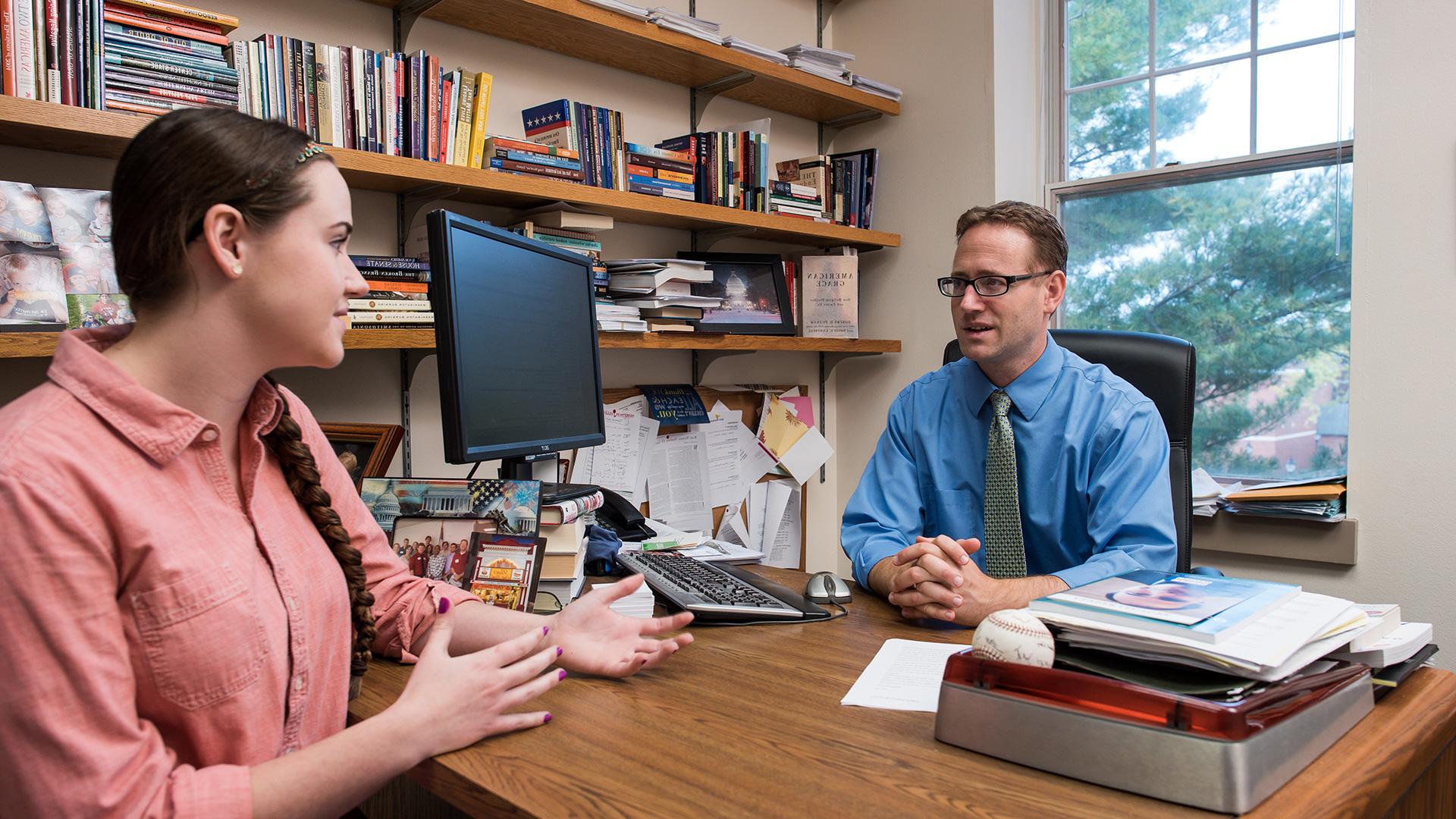 Simpson College professor Kedron Bardwell consults a student